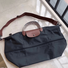 Carregar imagem no visualizador da galeria, NOVA Maxi Bolsa Origami EXPANSÍVEL para Viagem COM LOGO e Alça Transversal (TAMANHO XXG) - Lançamento 2025